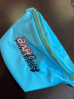 Wear as a crossbody or hip pack. Perfect for race day, concerts, or workouts. Neon, nylon, adjustable strap, and zippered pockets. Buy Now!